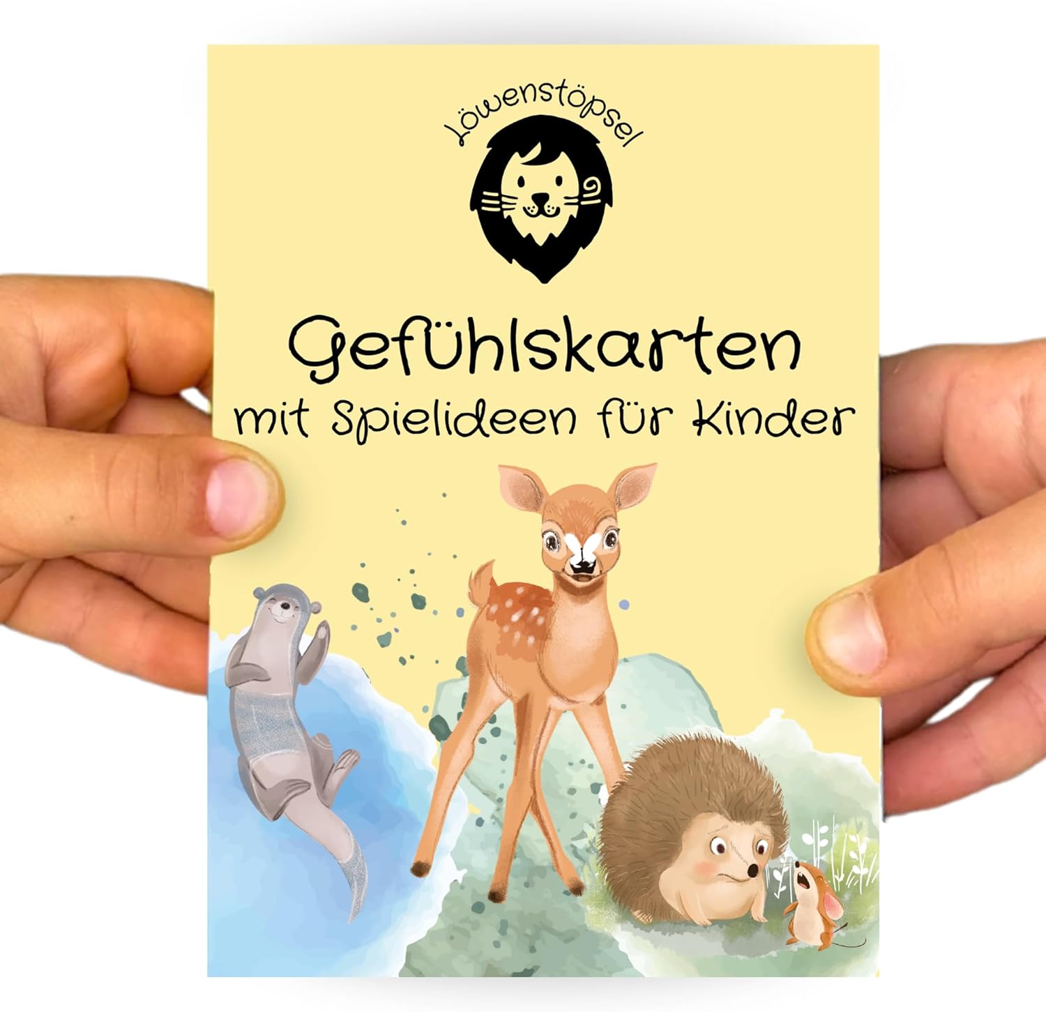 Gefühlskarten-Set mit Tiermotiven und Spielideen, gehalten von zwei Kinderhänden.